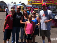 The Maddox and Delanoi families marvel at mac-and-cheese-filled cheeseburgers and search for a puppet driving a Coca Cola truck at the California State Fair.