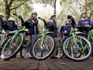 A group of cyclists prepares to take an inaugural ride on new rental bikes Monday, Oct. 13, 2014, in Seattle. 