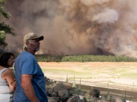 Linda and Jeff Sprague of Mendocino watch the Salt Fire spread in Shasta County.