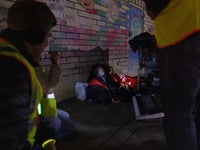 Unhoused resident Brian McCurdy is interviewed by PIT count volunteers on Wednesday, Feb. 23, 2022.