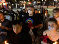 Vigil attendees gather at 7th and K street in Downtown Sacramento on Monday, April 4, 2022.