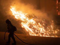 Firefighters battle the Mosquito Fire near Foresthill, Calif. Wednesday, Sept. 7, 2022.