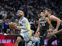 Golden State Warriors guard Stephen Curry drives to the basket while trailed by Sacramento Kings forwards Domantas Sabonis, right, and Keegan Murray during the second half of Game 7 of their NBA first-round playoff series Sunday, April 30, 2023.