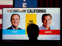 Photos of U.S. Rep. Adam Schiff, D-Calif., at left, a U.S Senate candidate, and his Republican opponent Steve Garvey flash on a television screen during an election night party for Schiff, Tuesday, March 5, 2024, in Los Angeles.