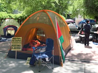 Students protesting the war in Gaza and calling for the university to divest from companies tied to it gather at the Sacramento State library quad on Monday, April 29, 2024.