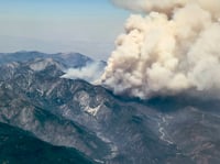 Smoke rises from the Vista fire as seen from a flight into Los Angeles International Airport on Tuesday, July 9, 2024, over Los Angeles.