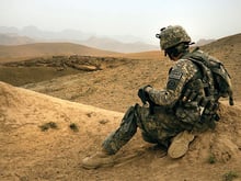 A soldier with U.S. Army Europe's Foxtrot Company, 2nd Squadron, 2nd Stryker Cavalry Regiment, takes a break during a dismounted patrol near Combat Outpost Mizan, Afghanistan, August 16, 2010