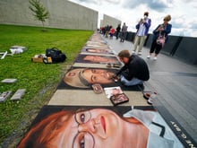 Chalk artist Eric Greenawalt, of Pittsburgh, works on a chalk portrait of Todd Beamer, one of the 40 passengers and crew who perished on Flight 93, on Friday, Sept. 10, 2021, at the Flight 93 National Memorial in Shanksville, Pa.