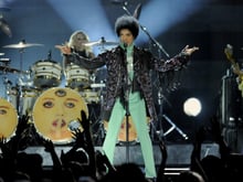  In this May 19, 2013 file photo, Prince performs at the Billboard Music Awards at the MGM Grand Garden Arena, in Las Vegas. Fox's post-Super Bowl party will include Prince making a guest appearance on the comedy "New Girl."