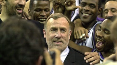 Sacramento Kings coach Rick Adelman, center, is mobbed by his players at Arco Arena in Sacramento, Calif., after the Kings defeated the Orlando Magic 112 -100, marking Adelman's 500th career coaching victory, Tuesday, Dec. 11, 2001. AP file photo