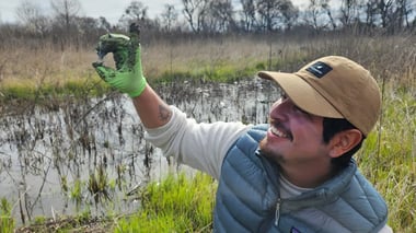 Restoration scientist Diego Garcia holds up a soil sample collected at Dos Rios State Park near Modesto, Feb. 28, 2025. Sarit Laschinsky/CapRadio