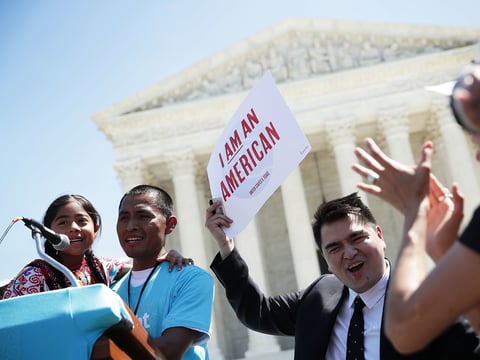 Six-year-old Sophie Cruz speaks during a rally in front of the Supreme Court next to her father Raul Cruz and supporter Jose Antonio Vargas in 2016.
