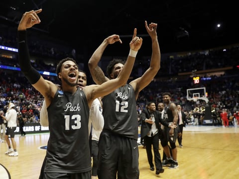Nevada guard Hallice Cooke (13) and forward Elijah Foster (12) celebrate at the end end of the second half of a second-round game against Cincinnati, in the NCAA college basketball tournament in Nashville, Tenn., Sunday, March 18, 2018.