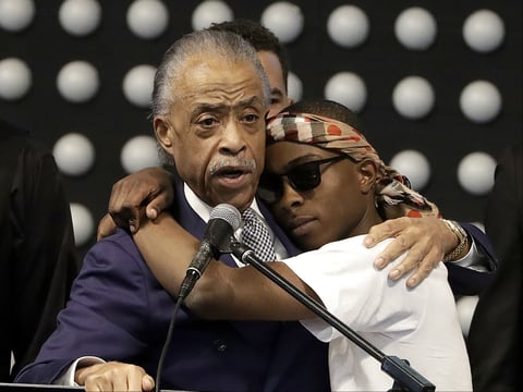 Rev. Al Sharpton, left, speaks to Stevante Clark during the funeral services for police shooting victim Stephon Clark at Bayside Of South Sacramento Church in Sacramento, Calif., Thursday, March 29, 2018.