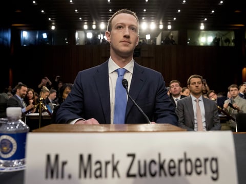 Facebook CEO Mark Zuckerberg arrives to testify before a joint hearing of the Commerce and Judiciary Committees on Capitol Hill in Washington, Tuesday, April 10, 2018, about the use of Facebook data to target American voters in the 2016 election.