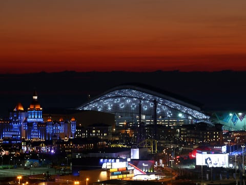 The sun sets at the Olympic Park just ahead of the Opening Ceremony of the Sochi 2014 Winter Olympics at Fisht Olympic Stadium in Russia.