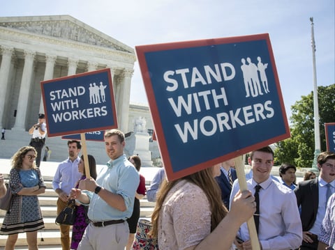 People gather at the Supreme Court on June 25 awaiting a decision in an Illinois union dues case, Janus vs. AFSCME. 