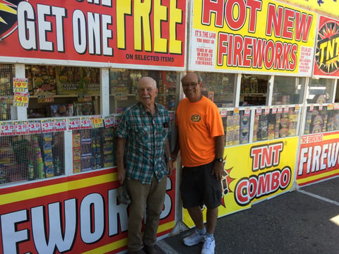 Tom Kearney and Frank Meder of the Fort Sutter Racing Pigeon Club outside a Sacramento area fireworks stand. The club was established in 1930.