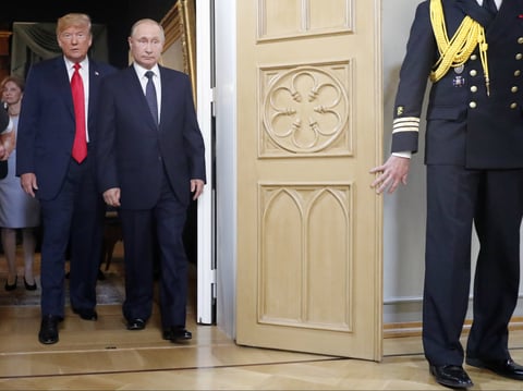 U.S. President Donald Trump, left, and Russian President Vladimir Putin arrive for a one-on-one-meeting at the Presidential Palace in Helsinki, Finland, Monday, July 16, 2018.