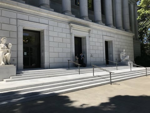 Chico Publishing Inc. co-owner Deborah Redmond and attorney Dan Laidman talk outside the 3rd District Court of Appeals in Sacramento.