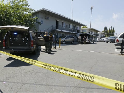 Crime scene tape blocks the entrance to an apartment complex following the arrest of a 45-year-old Iraqi refugee, Omar Ameen, Wednesday, Aug. 15, 2018, in Sacramento County.