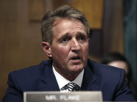 Sen. Jeff Flake, R-Ariz., speaks during the Senate Judiciary Committee hearing about an investigation, Friday, Sept. 28, 2018 on Capitol Hill in Washington.