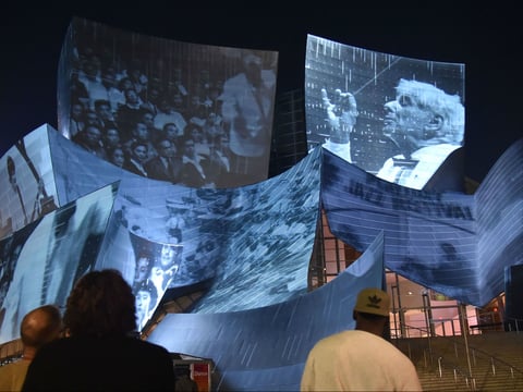 The site-specific art installation called "WDCH Dreams" by media artist Refik Anadol is projected onto the undulating stainless steel facade of the iconic Walt Disney Concert Hall in Sept. 2018 in Los Angeles.