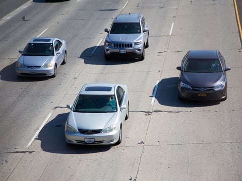 Cars drive on Highway 50 in Sacramento.