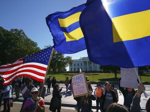 The National Center for Transgender Equality, NCTE, and the Human Rights Campaign gather on Pennsylvania Avenue in front of the White House in Washington, Monday, Oct. 22, 2018, for a #WontBeErased rally.