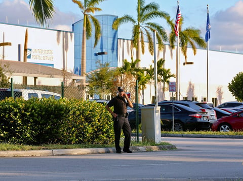 Police outside the U.S. Post Office Royal Palm Processing & Distribution Center, in Opa-locka, Fla. on Thursday.