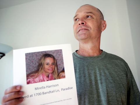 Bill Engfelt holds the flyer he made while searching for information on his sister, Mirella Harrison. She was listed as missing when a fire blew through her hometown of Paradise. She was eventually found safe.