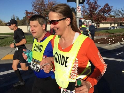 Deb Yoder, Paradise resident, runs with visually impaired athlete Phillip Ashley in the 2017 California International Marathon.