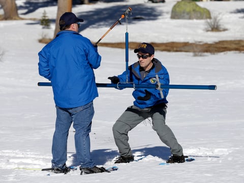 Department of Water Resources Water Resource Engineer John King, right, places the snow survey tube to on a scale held by DWR State Climatologist Dr. Michael Anderson, left , during the first snow survey of the season at Phillips Station, Thursday.