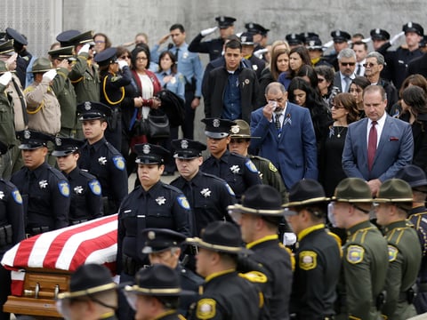 Family members follow the flag draped coffin of Davis Police Officer Natalie Corona before funeral services for Corona at the University of California, Davis, Friday, Jan. 18, 2019, in Davis, Calif.