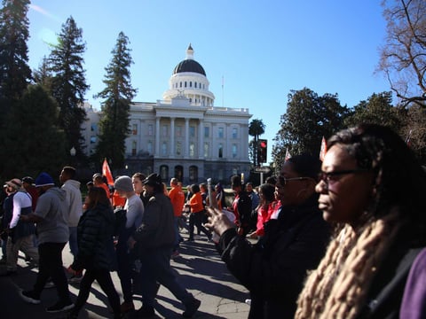 Marchers participating in the annual MLK Day March for the Dream honoring the legacy of Martin Luther King Jr. reach the Capitol.