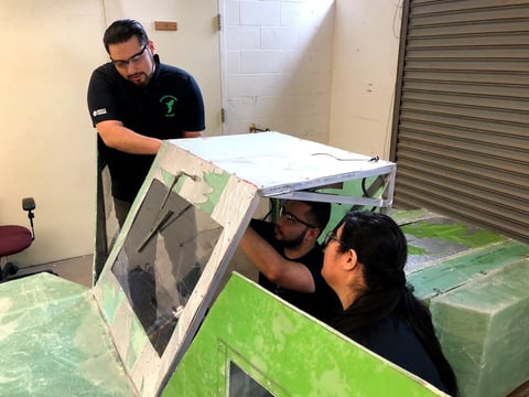Sacramento State students Adrian Calderon, Brayan De Dios, and Maria Baeza work on their urban concept gas-powered vehicle for the 2019 Shell Eco-Marathon Americas even at Sonoma Raceway this week.