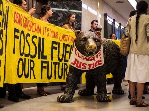 Anti-oil demonstrators at former Gov. Jerry Brown’s Capitol office.