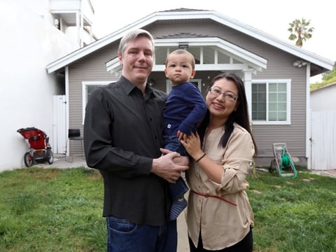 Inglewood taxpayers Jason and June Cao Jarvis, shown here at home with their 15-month-old son Kellar, say the federal tax cut actually increased their tax bill.