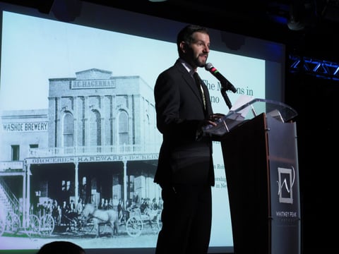The Reno Masonic Lodge built in 1872 is shown on a screen behind Nathan Digangi, worshipful master of Reno Lodge #13, as he speaks Tuesday, April 16, 2019, in Reno, at the unveiling of a time capsule found inside the recently demolished building.