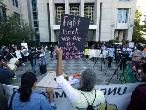 FILE - In this June 20, 2018, file photo, more than 100 protesters demonstrate outside the federal courthouse where a federal judge hears arguments over the U.S. Justice Department's request to block three California immigration laws in Sacramento.