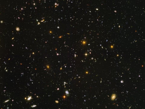This image made from a composite of September 2003 - January 2004 photos captured by the NASA/ESA Hubble Space Telescope shows nearly 10,000 galaxies in the deepest visible-light image of the cosmos, cutting across billions of light-years.