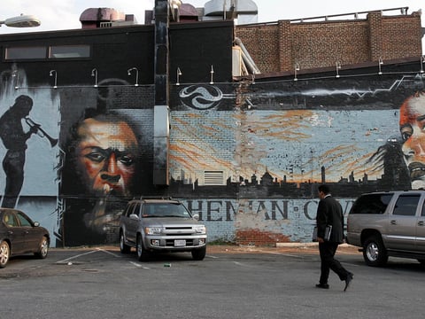 A mural depicts jazz greats Miles Davis and Billie Holiday on the side of the Bohemian Caverns club on Washington, D.C.'s U Street in 2005.