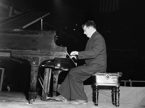 Dmitri Shostakovich, Russian composer-member of the Soviet delegation to the Cultural and Scientific conference for World Peace, plays the second movement of his Fifth Symphony at Madison Square Garden in New York City on March 27, 1949.