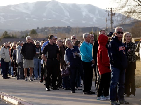 In this Tuesday, Feb. 23, 2016, file photo, voters line up to to vote in the Republican party caucus in Reno, Nev.