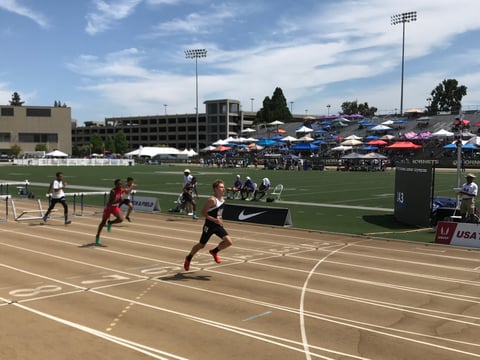 Micah Perry from Gresham, Oregon, wins a heat in the USATF Junior Olympics held at Sacramento State.
