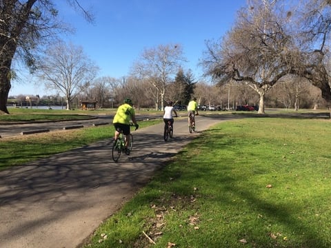 Cyclists take a President's Day holiday ride along the bike path at Discovery Park in Sacramento, at the confluence of the Sacramento and American Rivers.