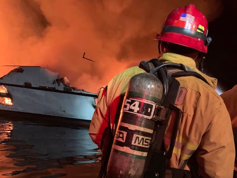 In this photo provided by the Ventura County Fire Department, VCFD firefighters respond to a boat fire off the coast of southern California, Monday, Sept. 2, 2019.