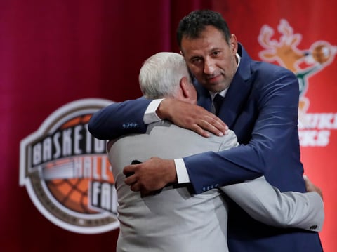 Inductee Vlade Divac, right, hugs his presenter, Jerry West, during the Basketball Hall of Fame enshrinement ceremony Friday, Sept. 6, 2019, in Springfield, Mass.
