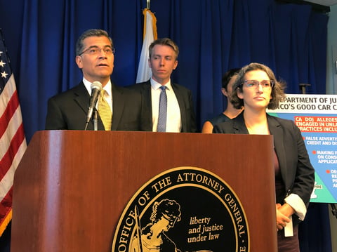 California Attorney General Xavier Becerra, left, speaks at a news conference, Monday, Sept. 23, 2019, in Sacramento, Calif., announcing a lawsuit against an auto dealer.
