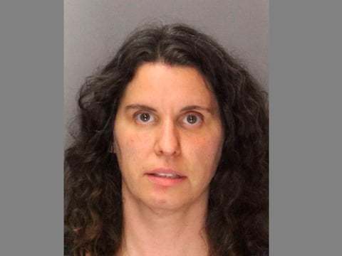 California police have arrested Rebecca Dalelio, who threw a feminine hygiene device containing "what appeared to be blood" onto the floor of the state Senate on Friday.
